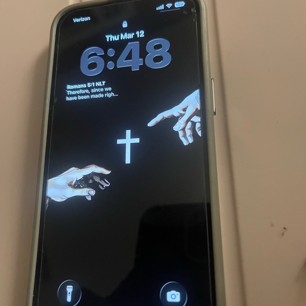 Apple iPhone 13 with White/Silver Case and Black Lock Screen
